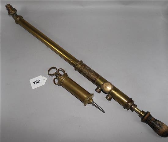 A brass syringe and sprayer